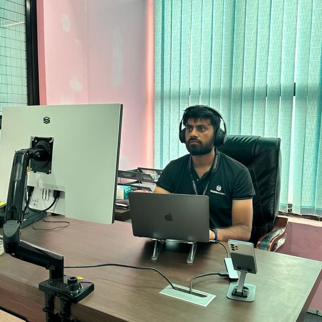 StableCluster team member working at a desk
